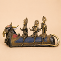 Antique brass bull with deity figures