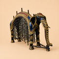 Antique brass elephant figurine with intricate details