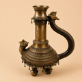 Antique brass ritual vessel with ornate details