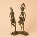 Antique bronze figurines in dance pose