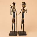 Decorative metal figurines with gold accents