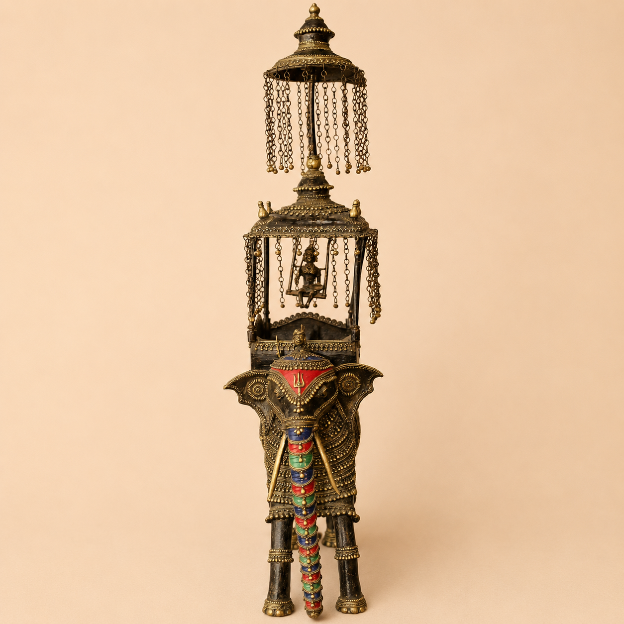 Ornate brass elephant sculpture with canopy