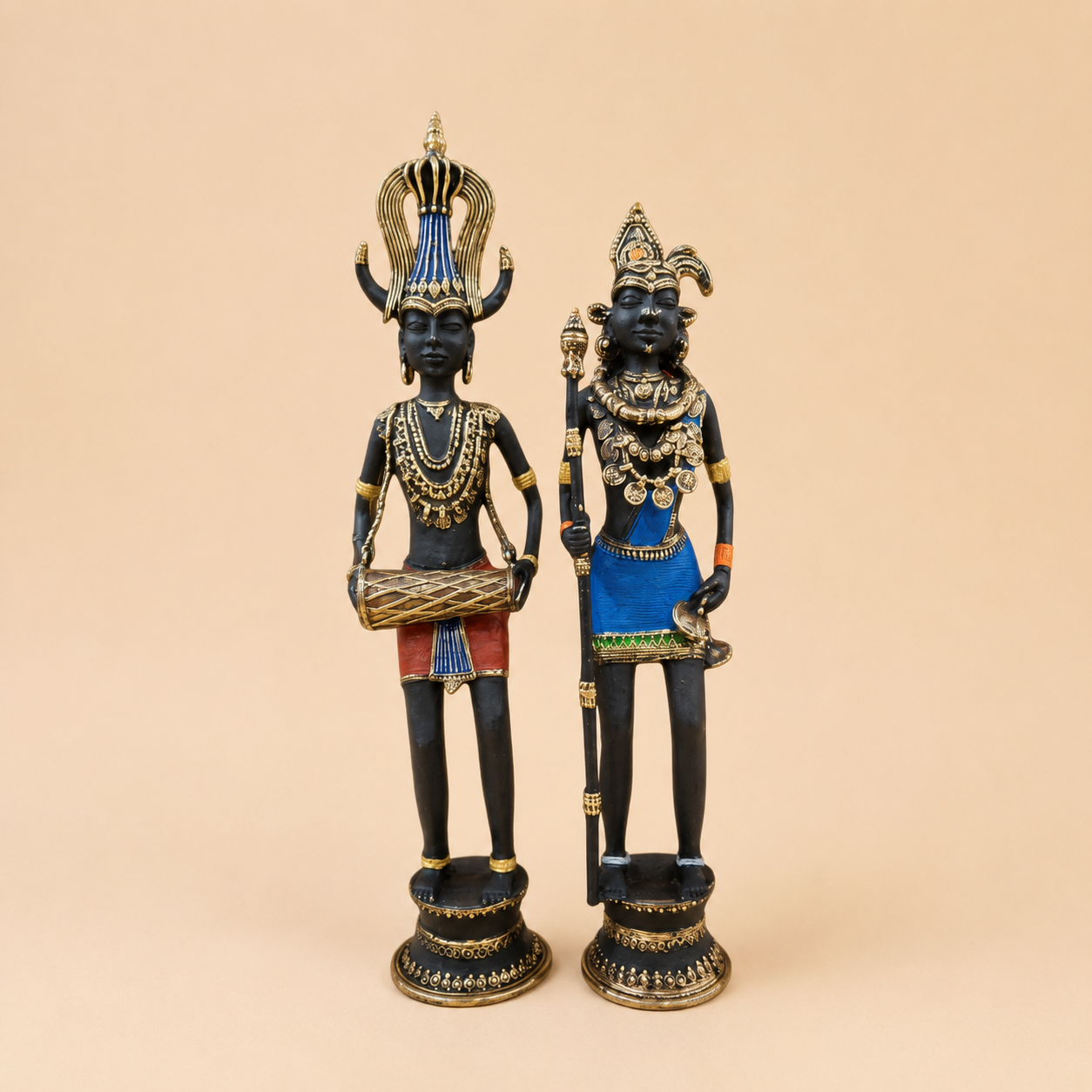 Ornate figurines with gold accents