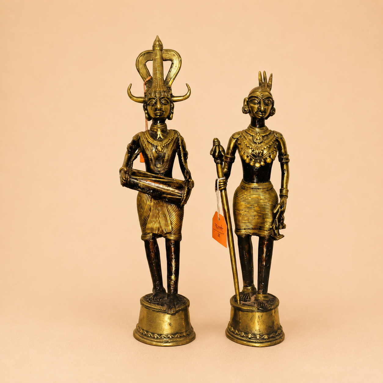 Tribal brass figurines in warm light